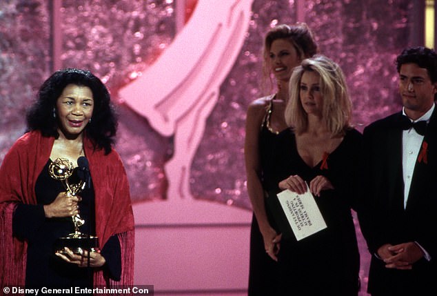 Thanks! Alice accepting an Emmy Award at The 45th Annual Primetime Emmy Awards in Pasadena, California; to the right are Heather Locklear and Andrew Shue from Melrose Place